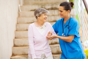 caregiver assisting patient in walking